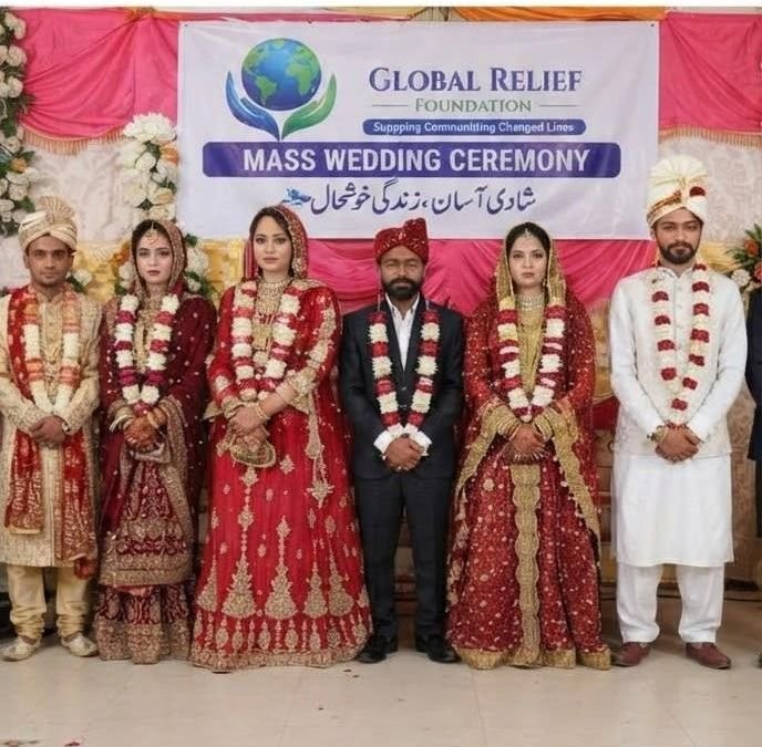 Couples standing together at a GRF mass wedding ceremony
